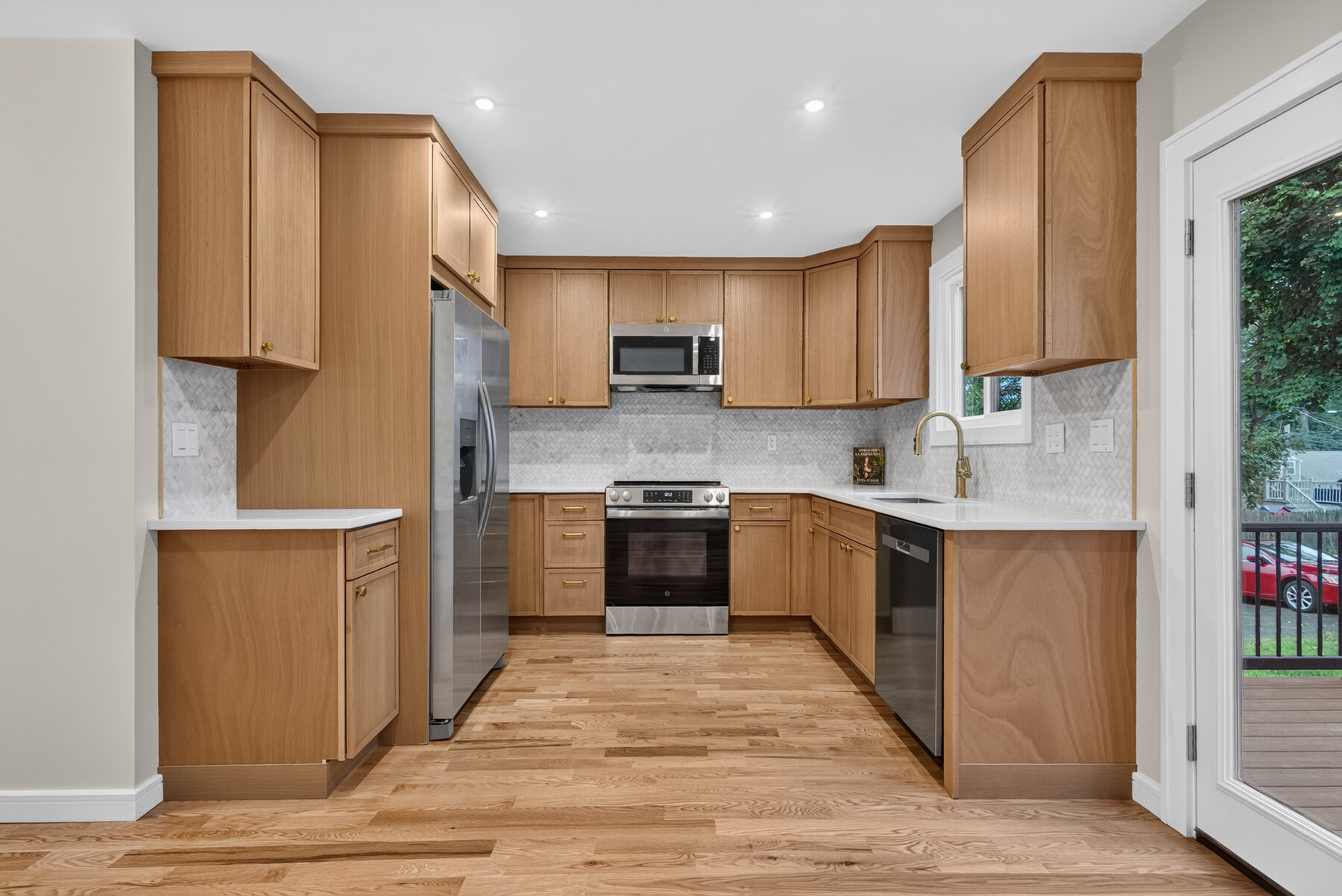 Completely remodeled kitchen with wood cabinetry and stainless steel appliances